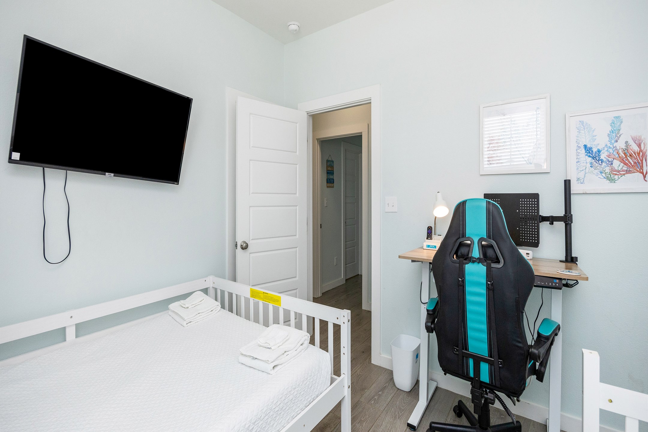 Third bedroom on the second floor with two full size beds, a twin trundle, desk, and a flat screen TV 