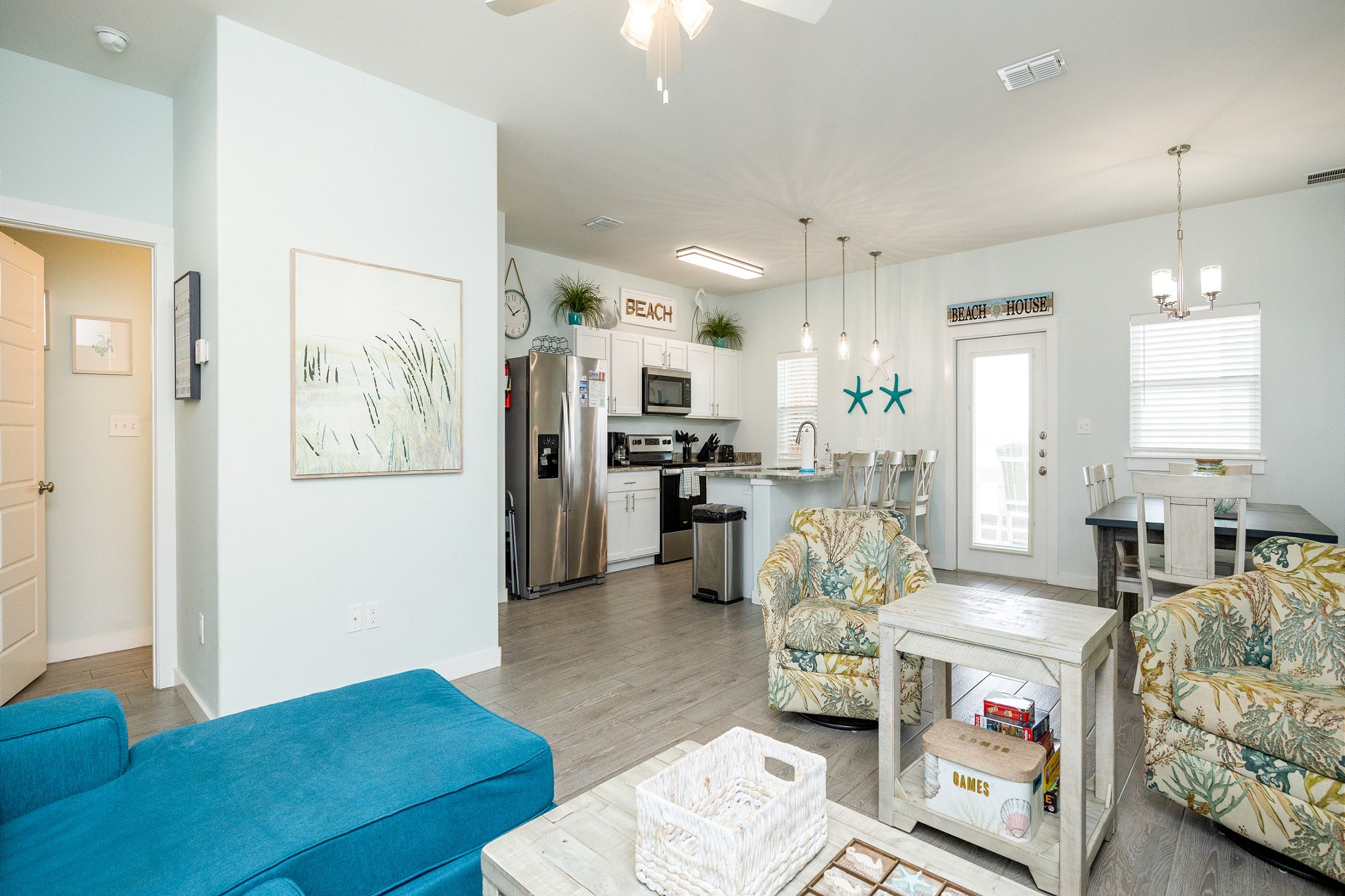 Welcoming living area bathed in sunlight, offering abundant seating for family fun and relaxation