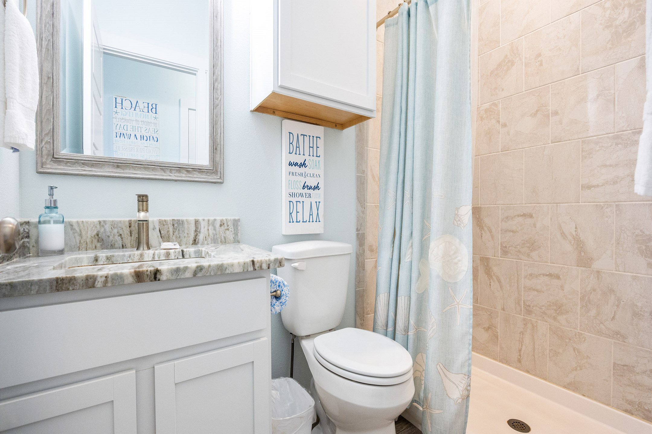 Master bathroom on the second floor with sink, toilet and walk in shower 