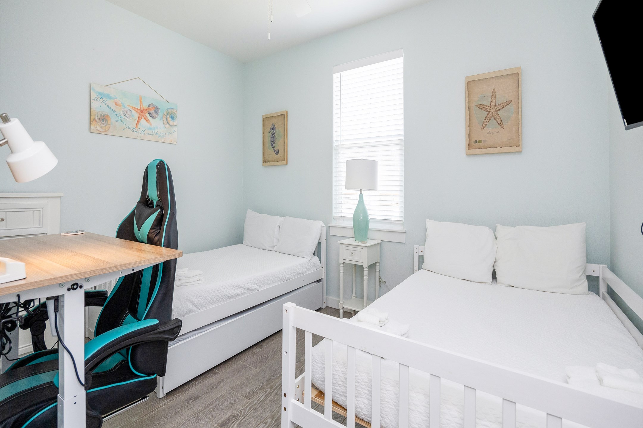 Third bedroom on the second floor with two full size beds, a twin trundle, desk, and a flat screen TV 