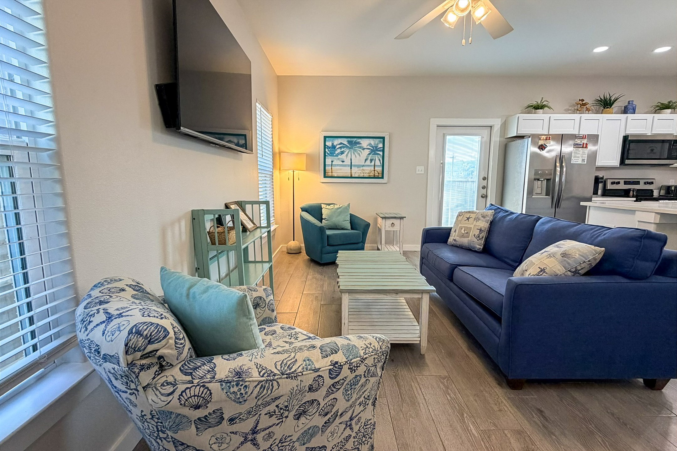 Stylish living room with modern furnishings, flat-screen TV, and streaming services