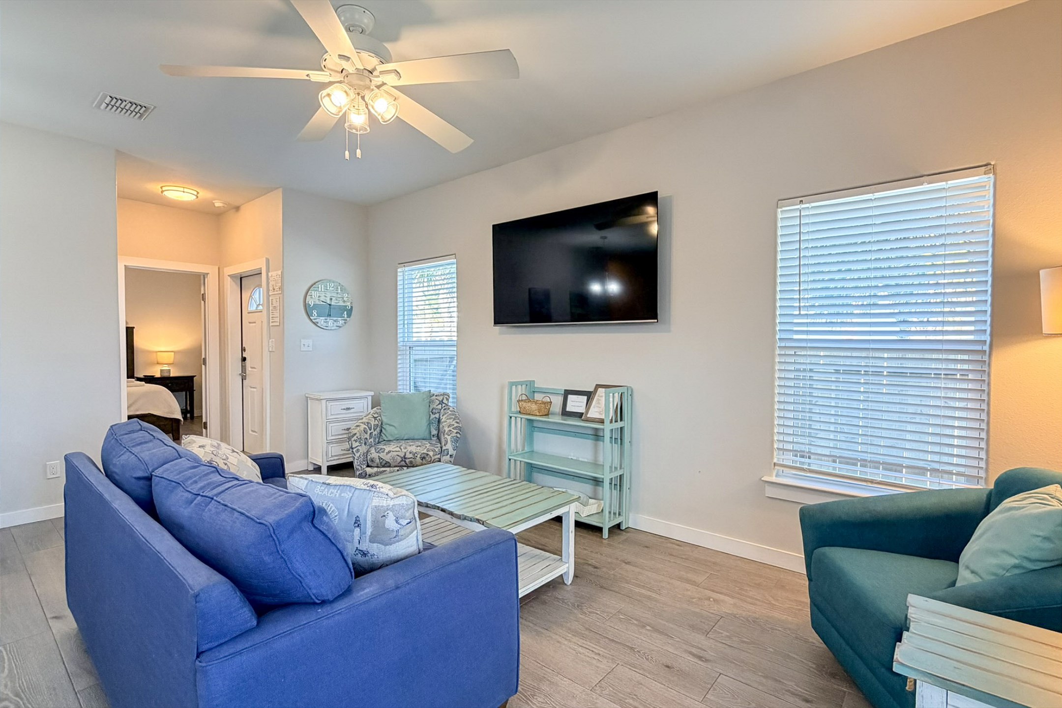 Cozy lounge space with large windows, ideal for unwinding after a beach day