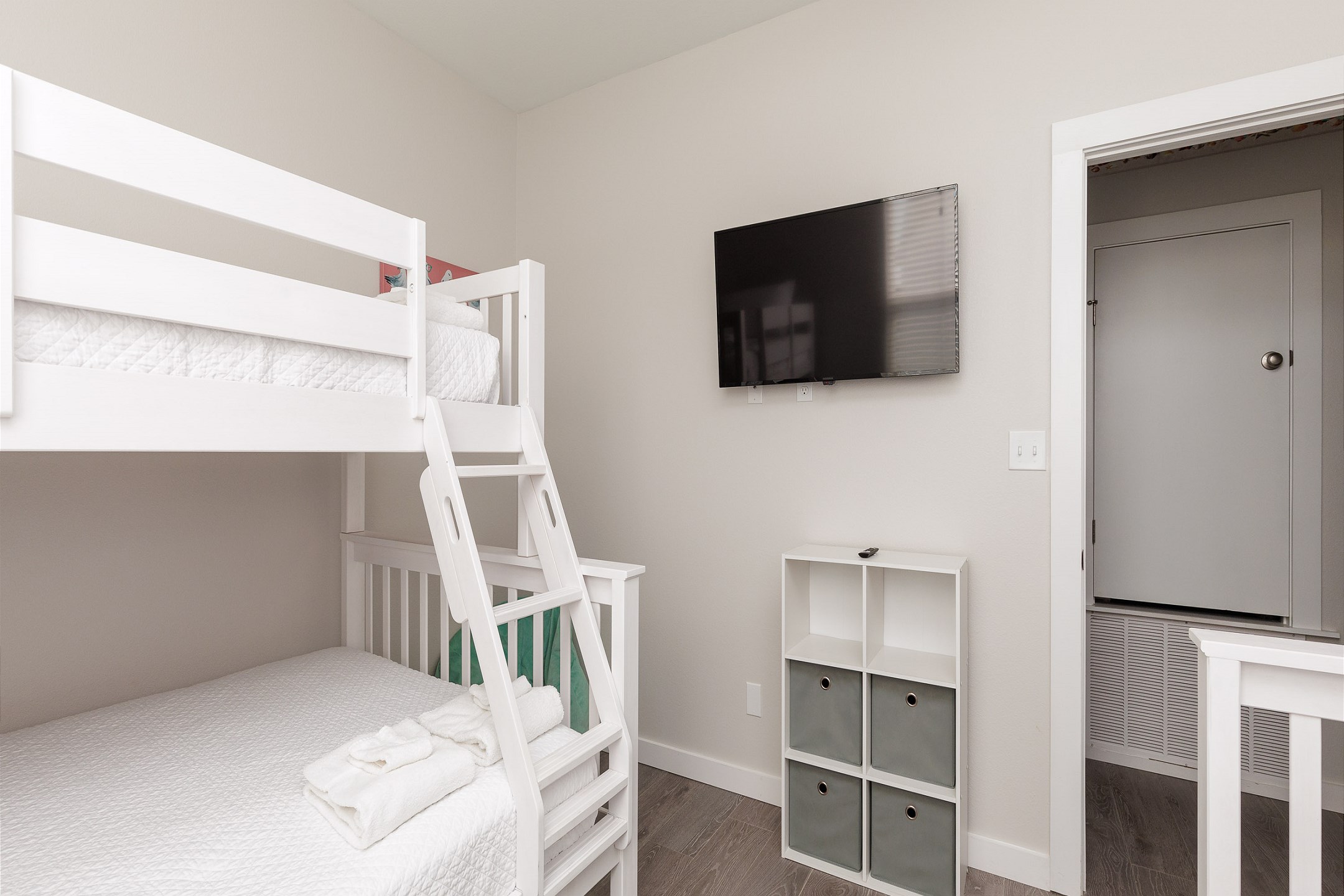 Fourth bedroom on the second floor with two sets of twin over full size bunk beds and flat screen TV