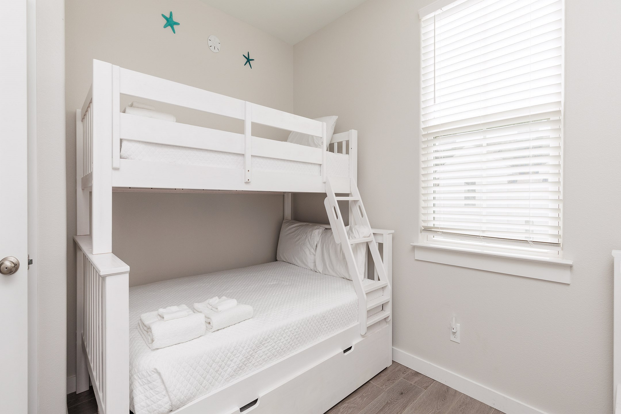 Fourth bedroom on the second floor with two sets of twin over full size bunk beds and flat screen TV