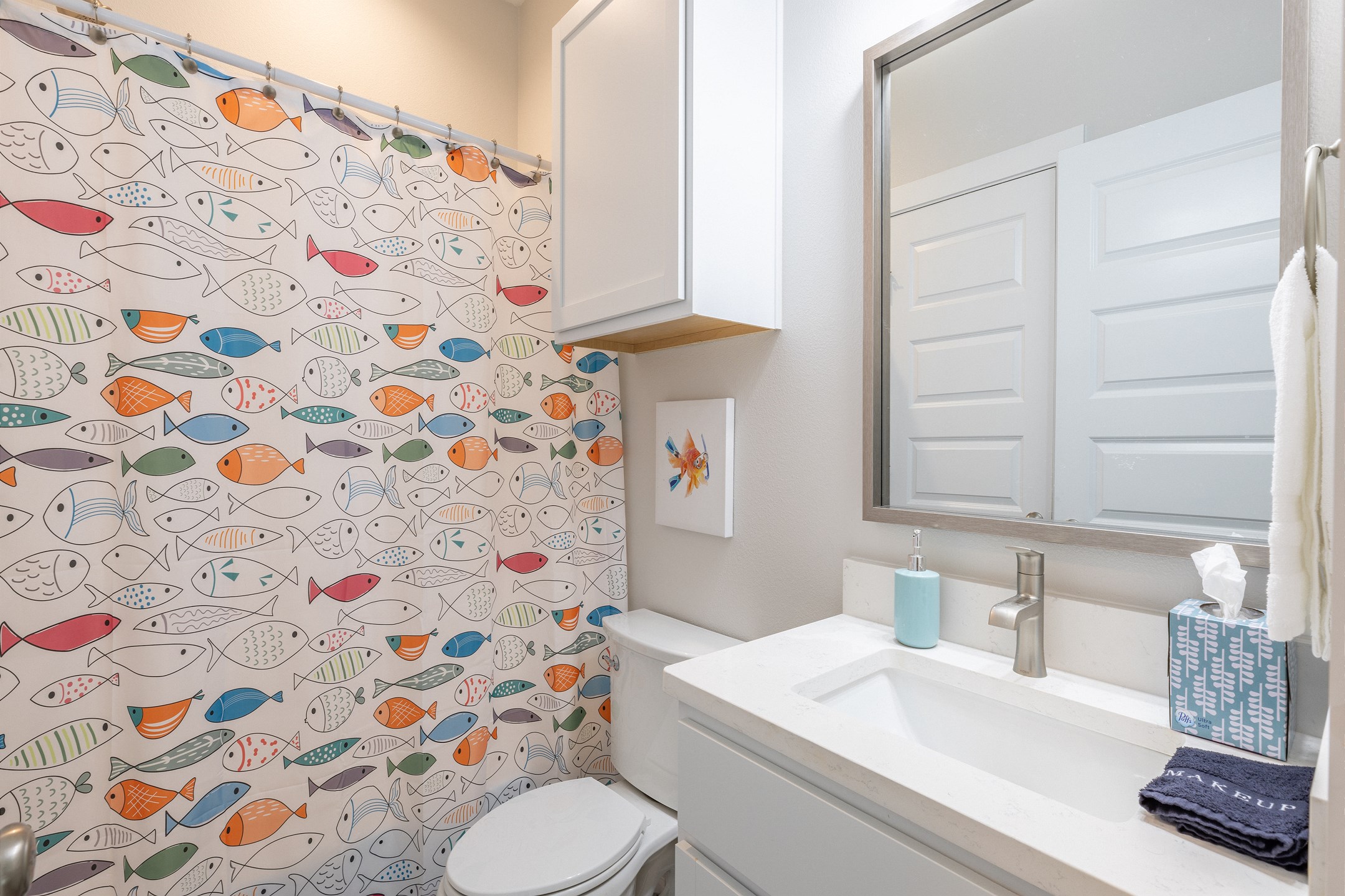 Guest bathroom on the second floor with sink, toilet, and tub/shower combo