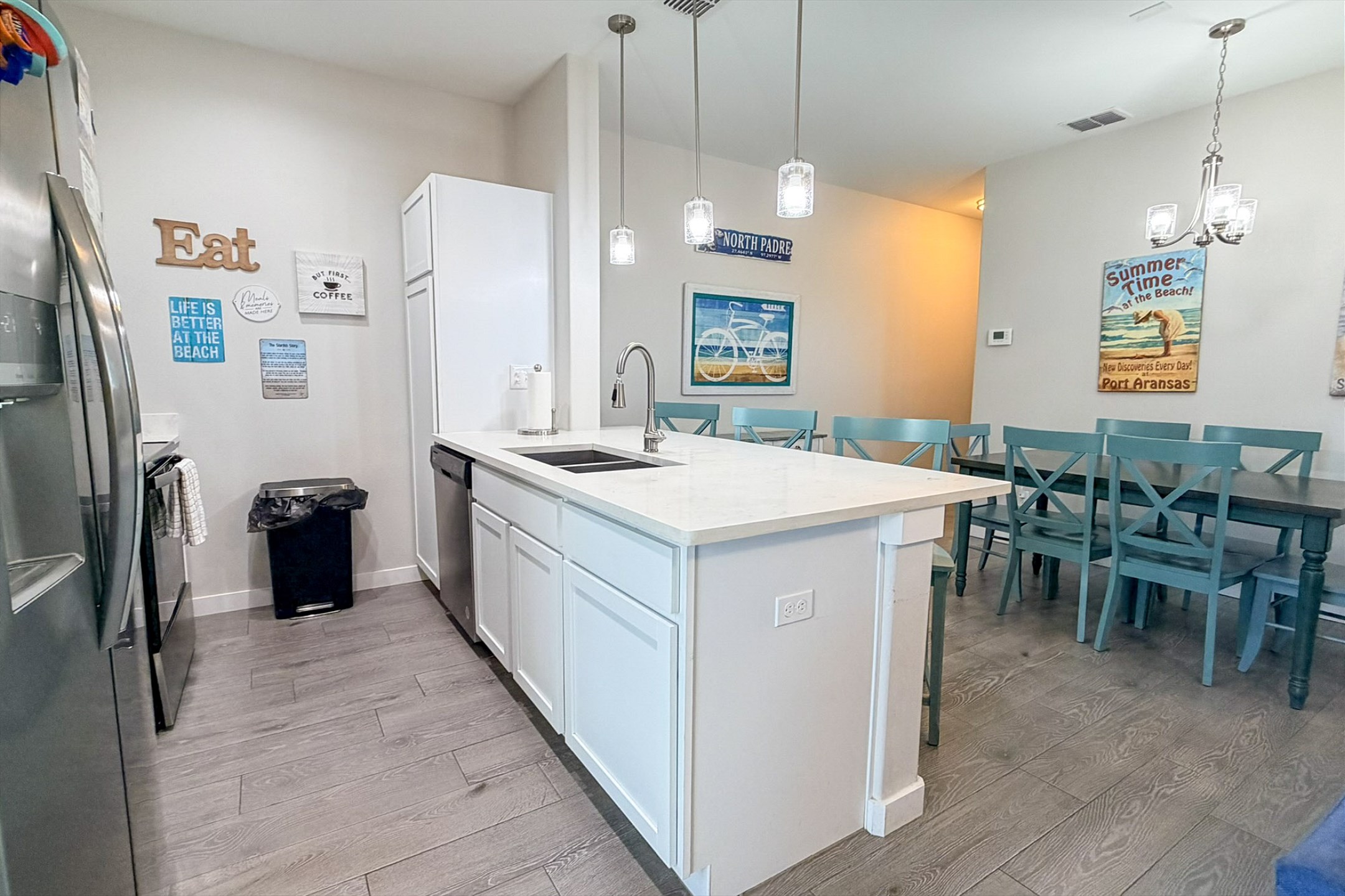 Open layout connecting the kitchen to the dining area which is great for family game night and meals together