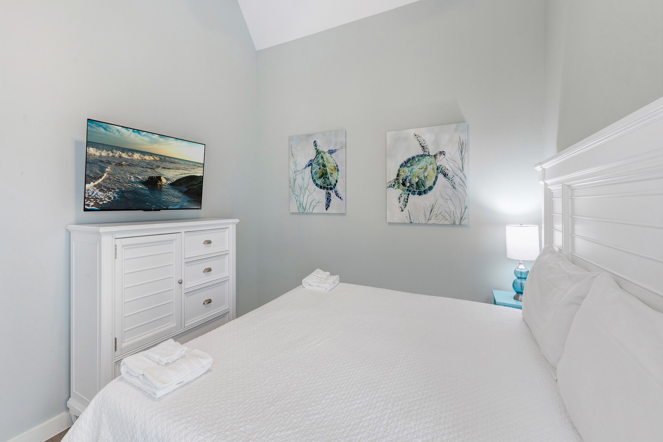 Master bedroom with king size bed and flat screen TV 