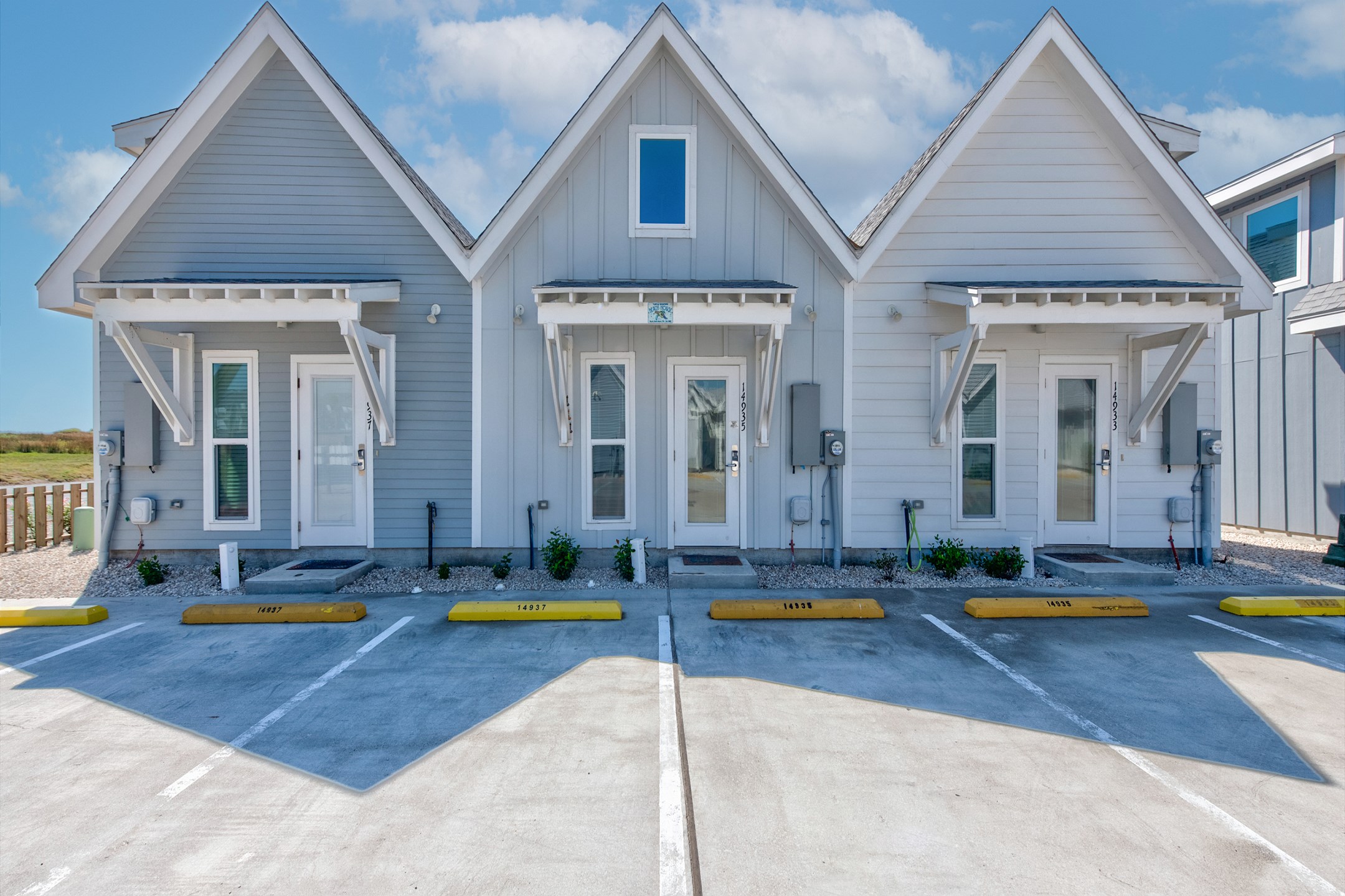 Front exterior of property with two assigned parking spaces 
