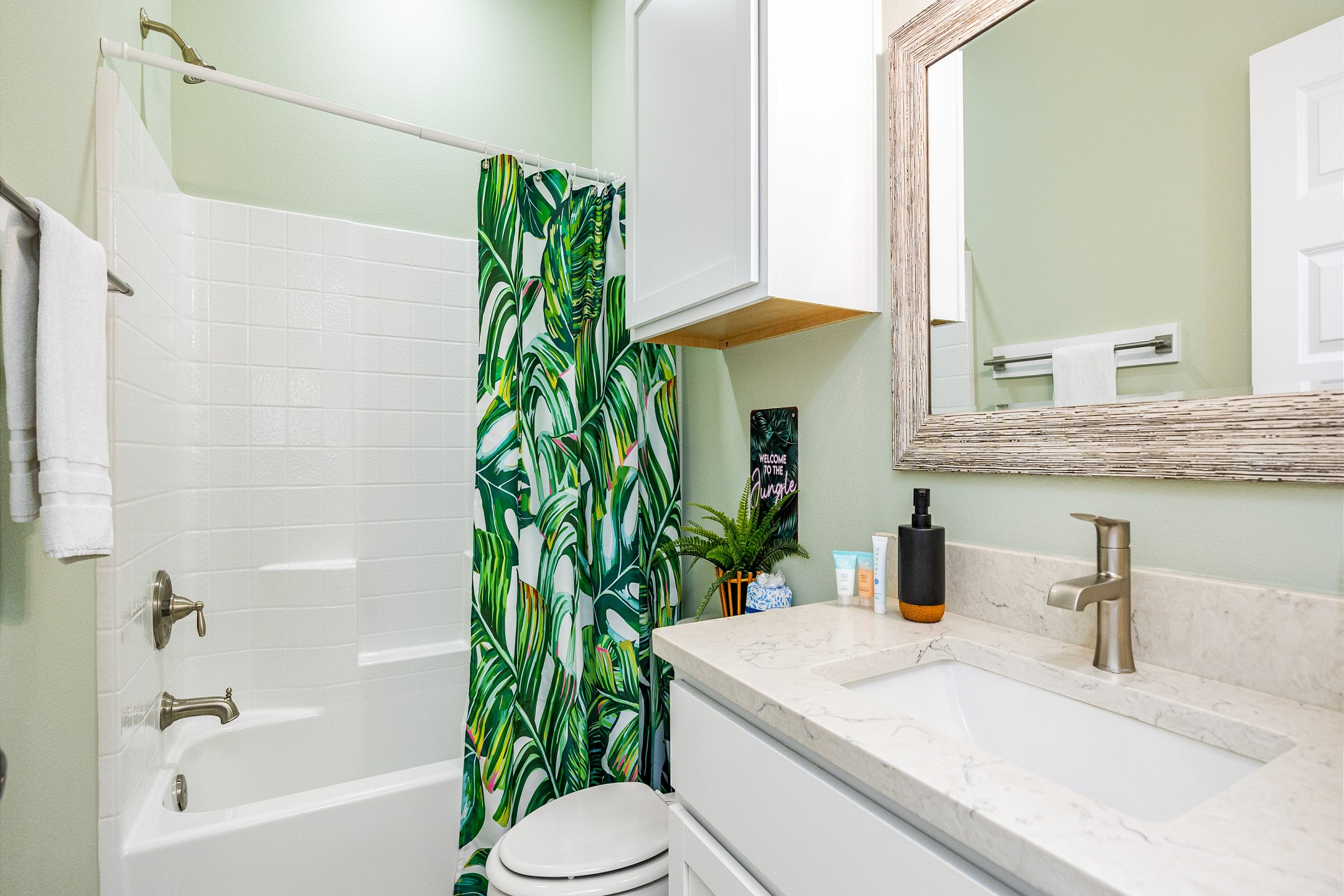 Guest bathroom on the second floor with tub and shower combo