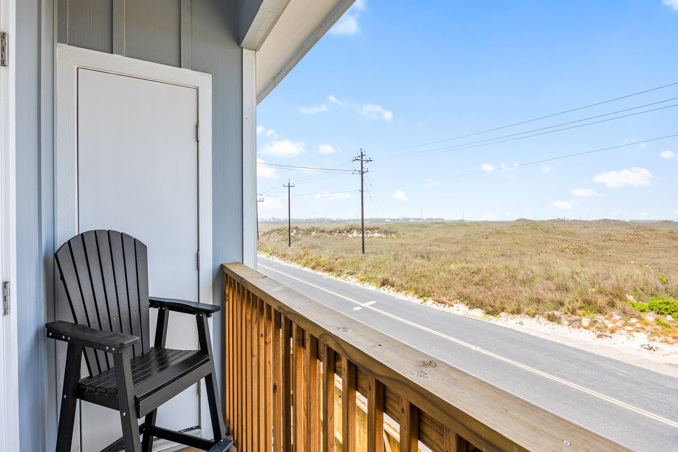 Second bedroom balcony with a view of the beach dunes and sound of waves crashing onshore