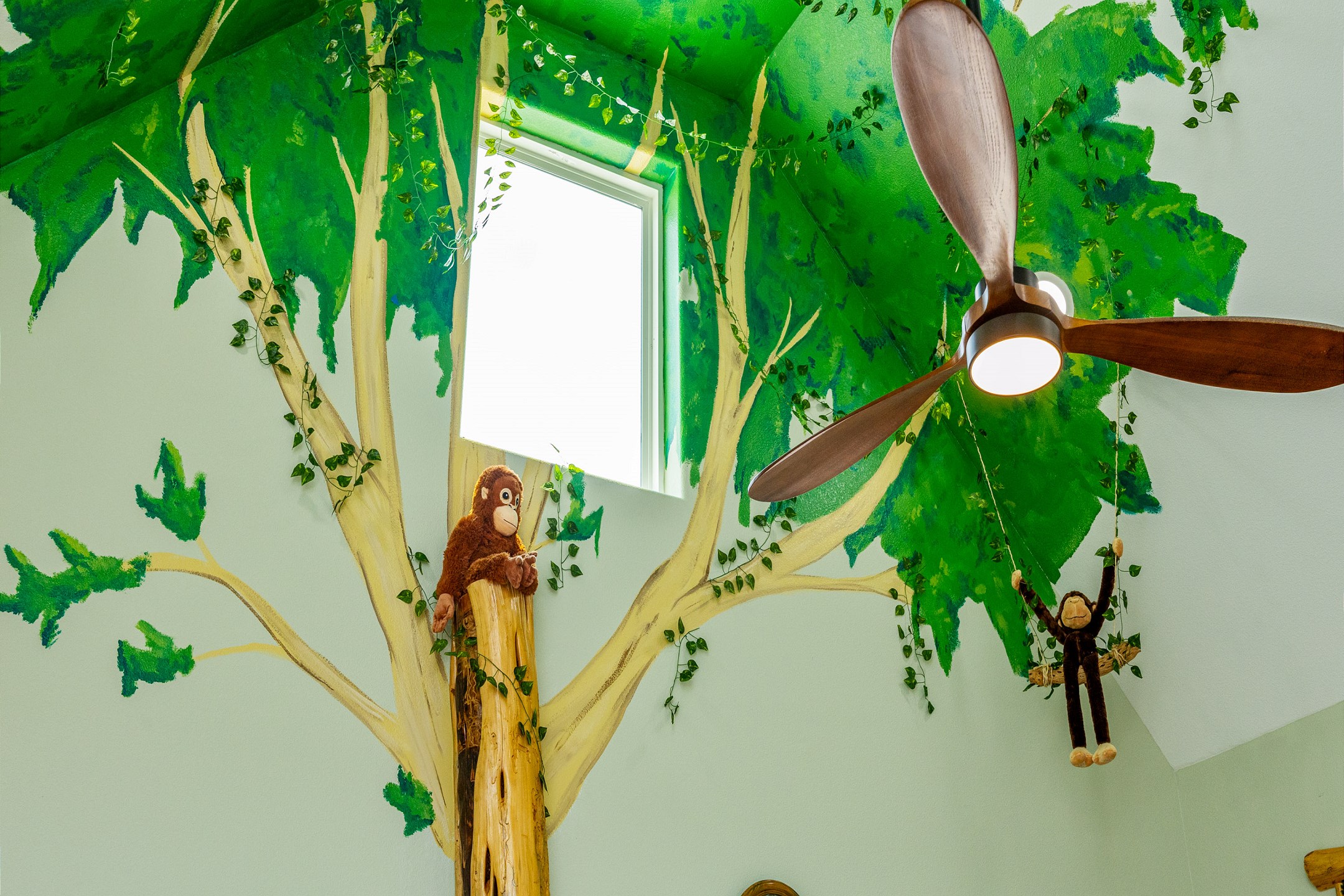 Unwind in the spacious living area beneath the jungle trees