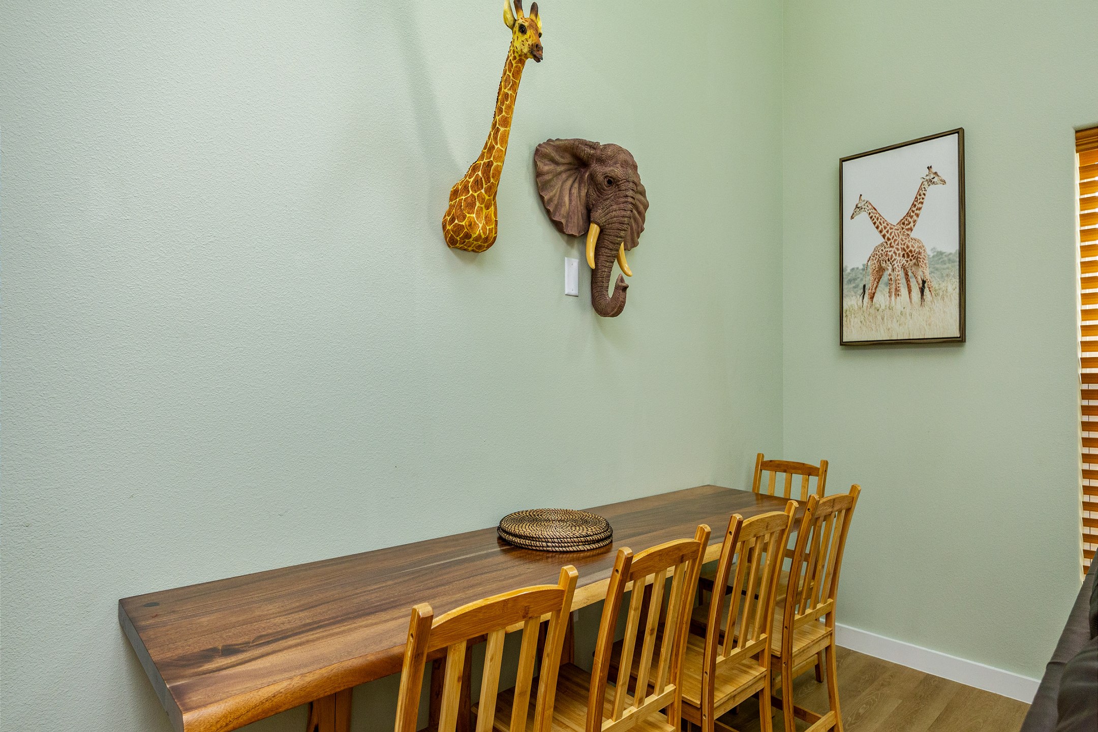 Dining area adorned with vibrant wildlife