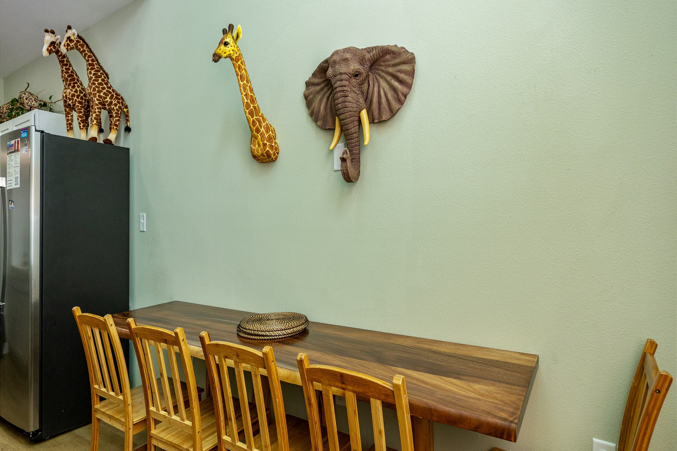 Dining area adorned with vibrant wildlife