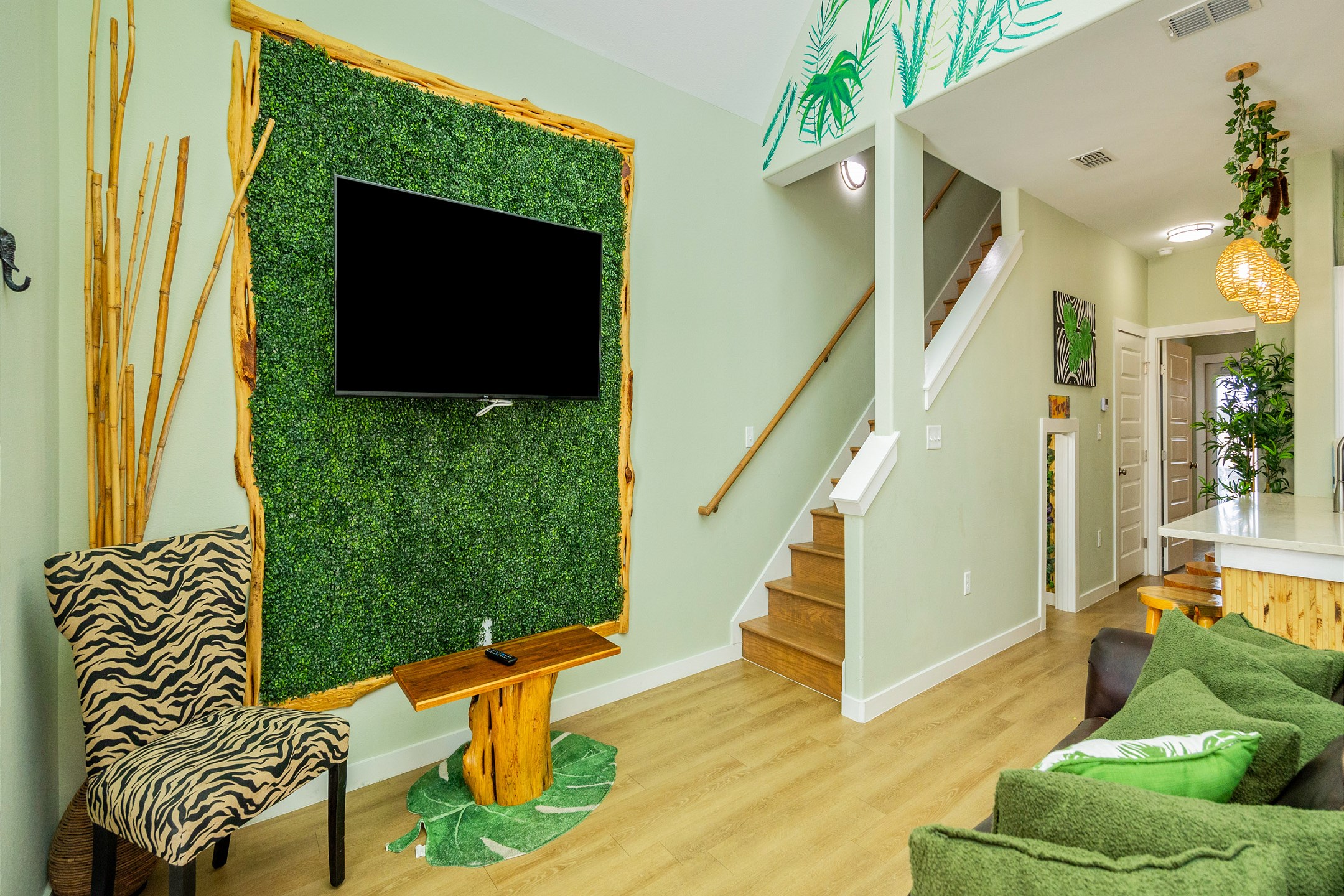 Adventure awaits in this scenic living area with a queen size sofa sleeper and jungle theme throughout