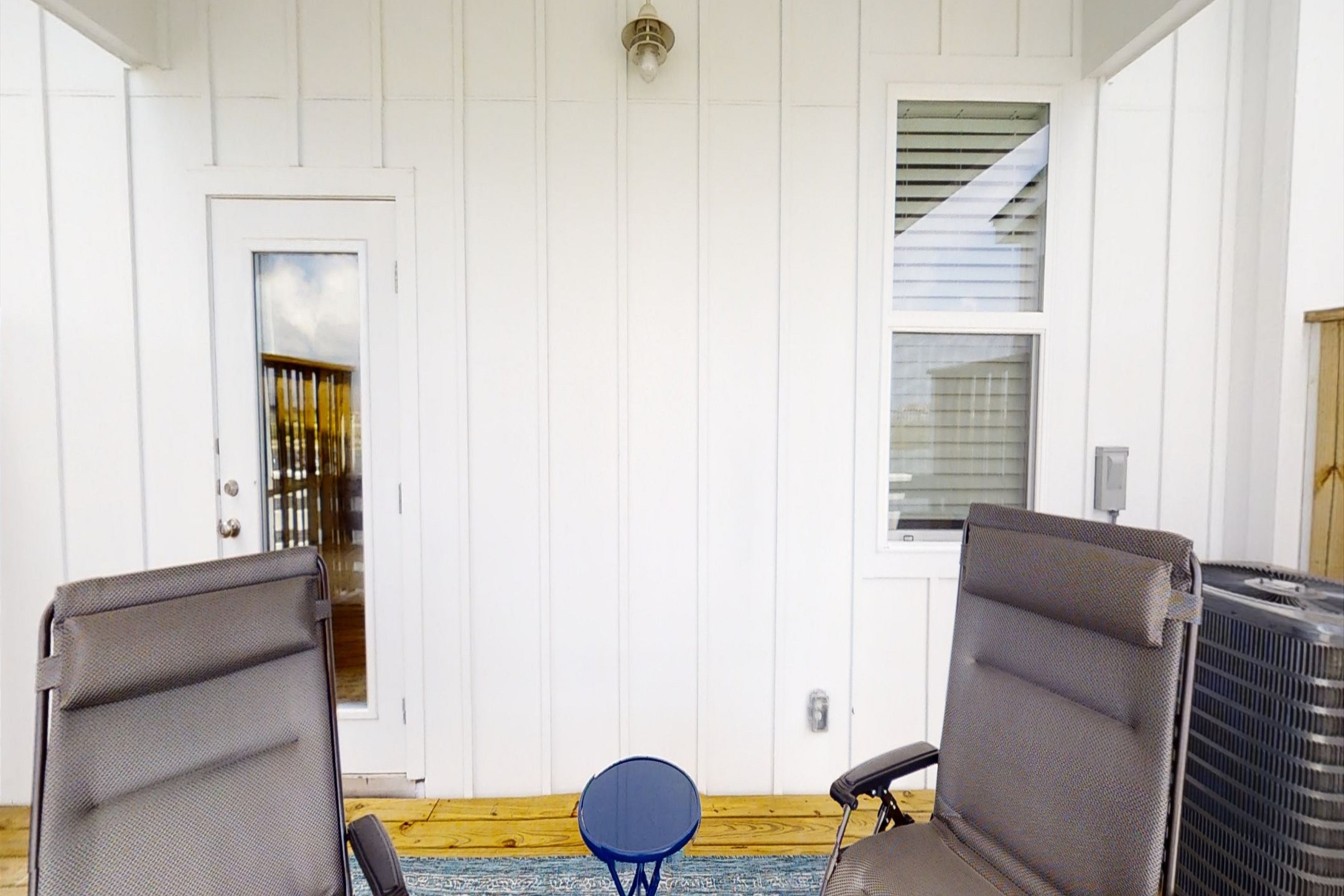 Step out onto the first-floor back patio offering picturesque water views and comfortable seating for a tranquil outdoor retreat