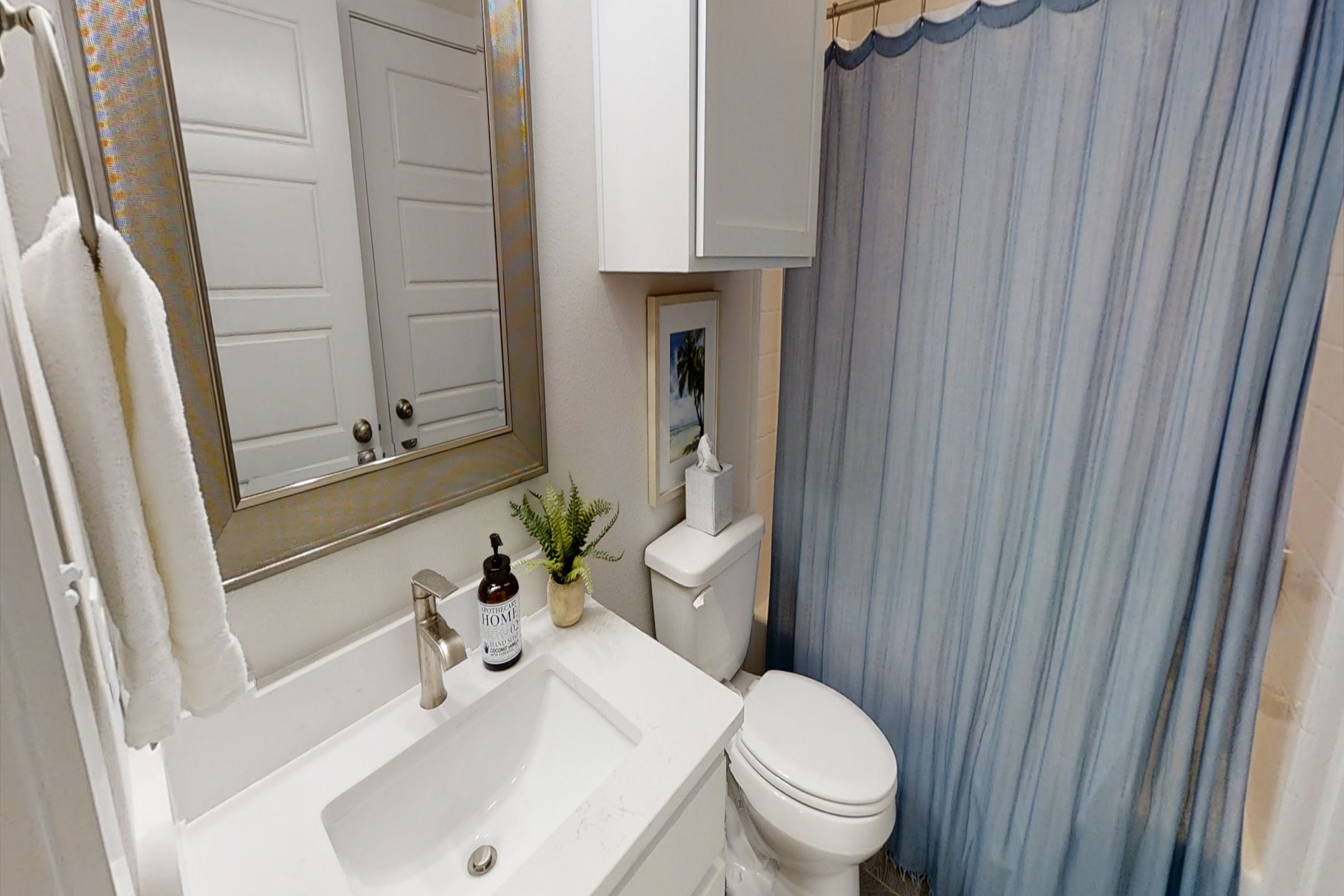 Guest bathroom on the second floor with tub / shower combo
