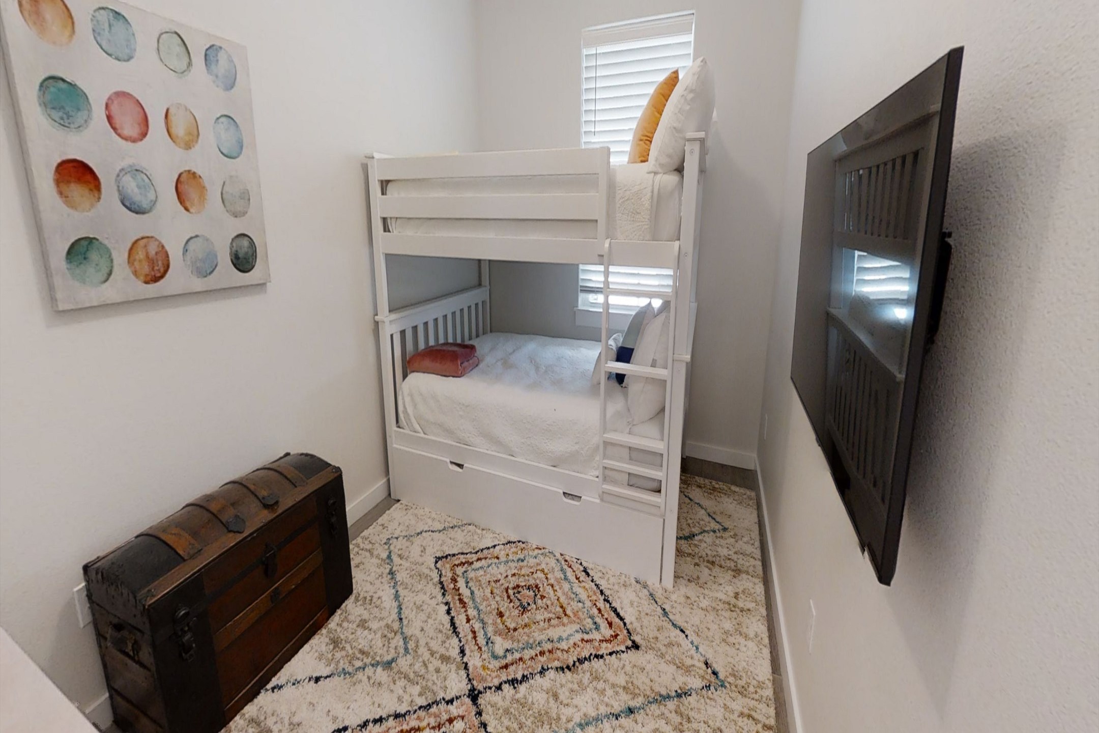 Third bedroom with a full over full bunk bed with a twin trundle, along with flat screen TV