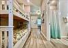 Twin bunk beds and washer / dryer in hallway nook