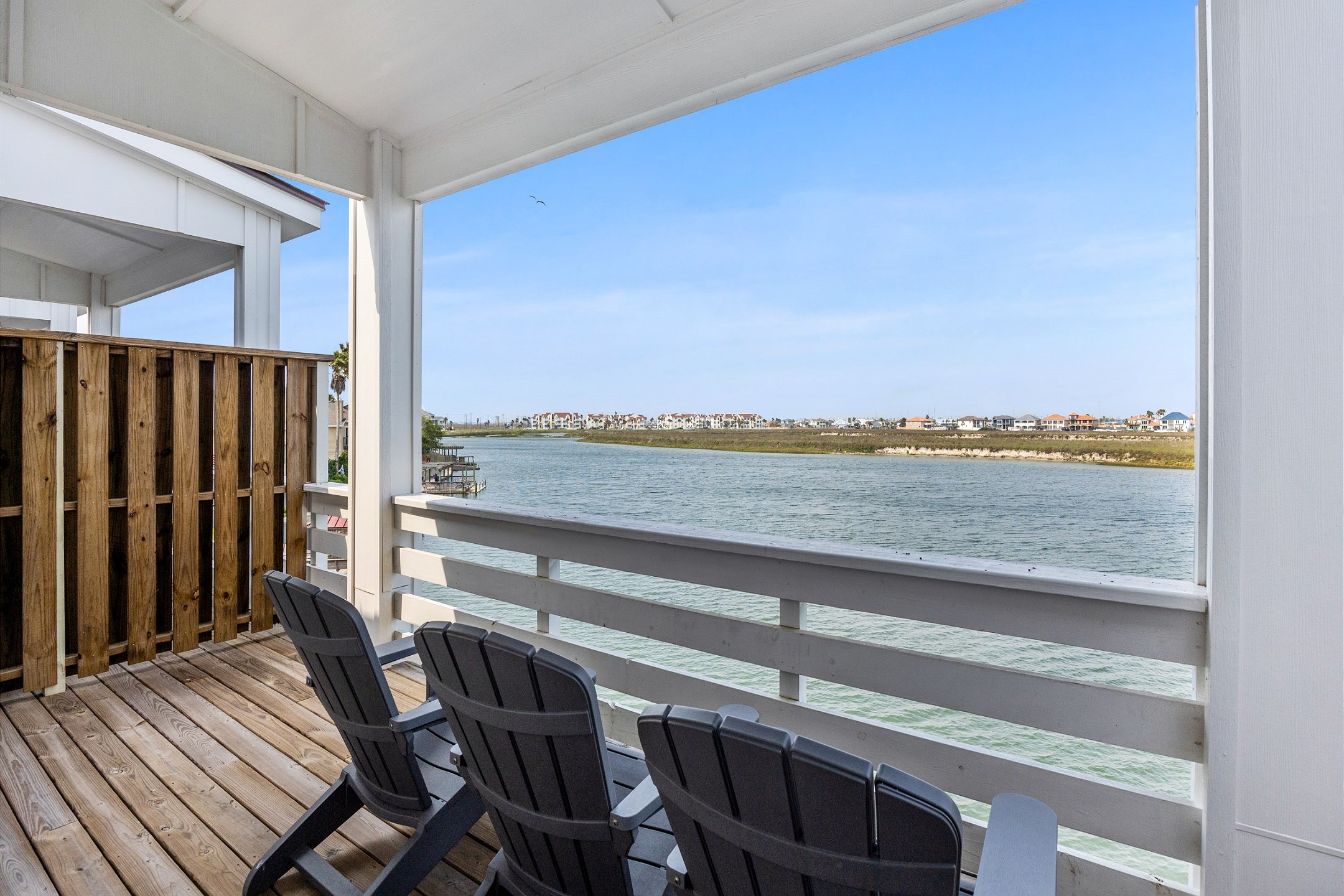 Private balcony off the master bedroom, featuring comfortable chairs to relax and savor the Texas breeze