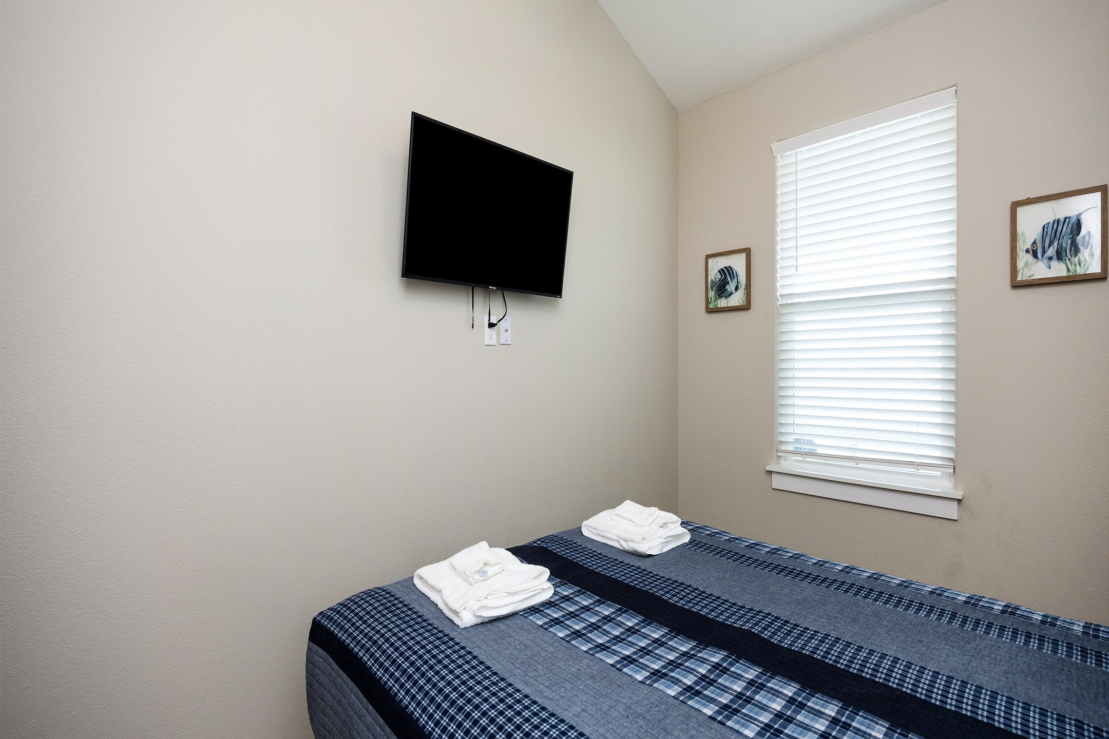 Second bedroom on the second floor with a full size bed and flat screen TV