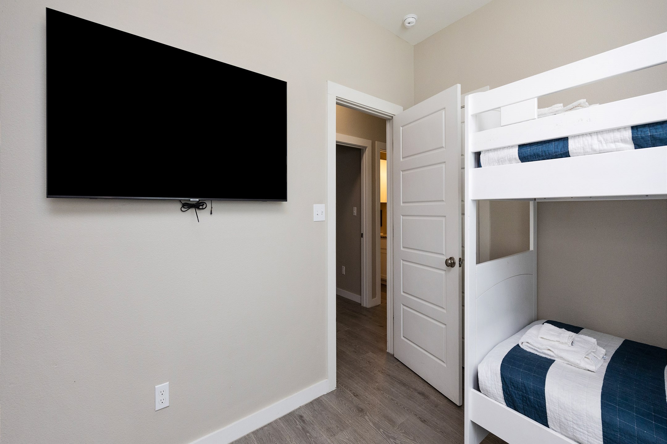 Third bedroom on the second floor with two sets of twin size bunk beds to accommodate four guests with flat screen TV