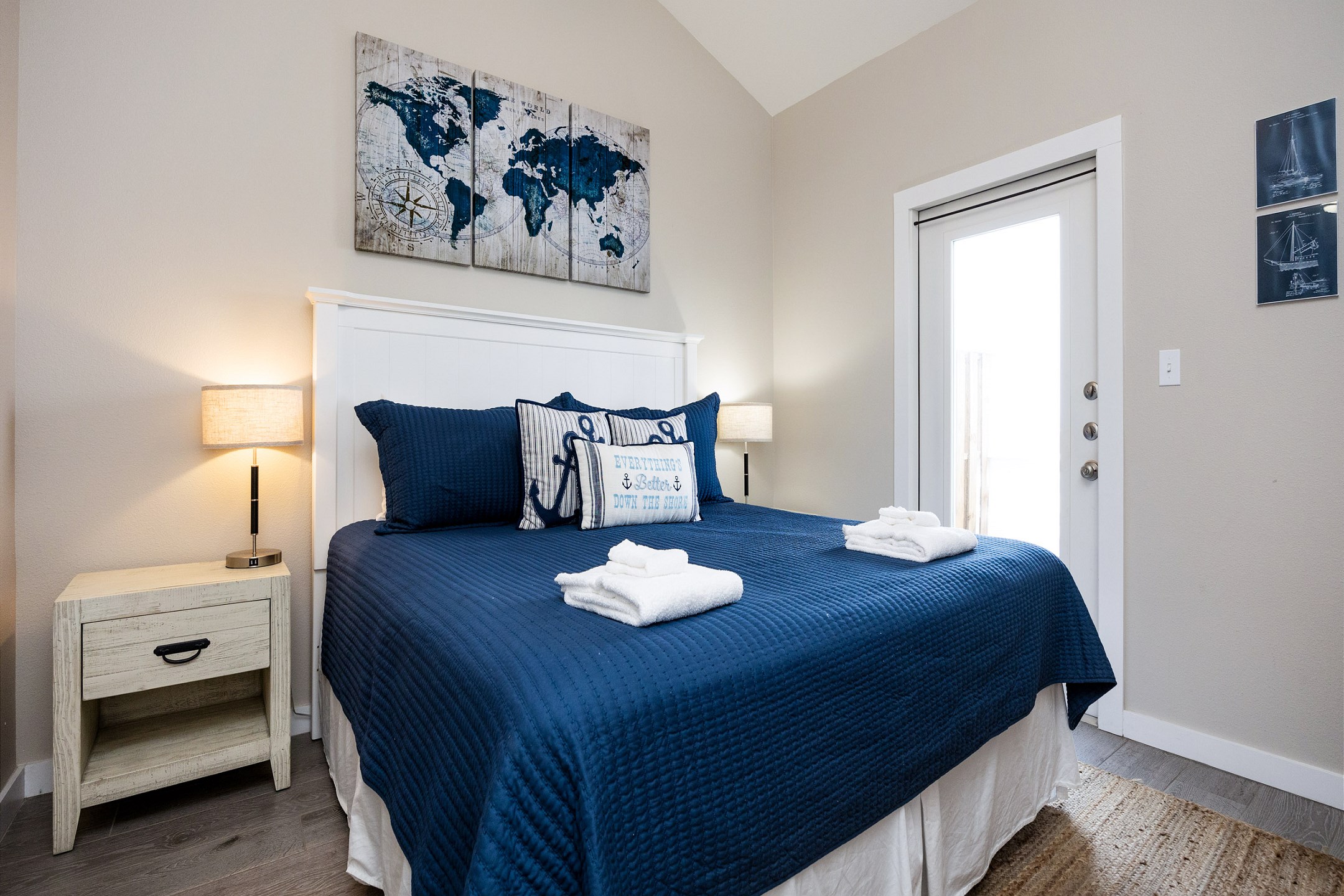 Master bedroom on the second floor with a king size bed, ensuite bathroom, private balcony with a water view and flat screen TV