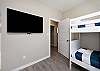 Third bedroom on the second floor with two sets of twin size bunk beds and a flat screen TV 