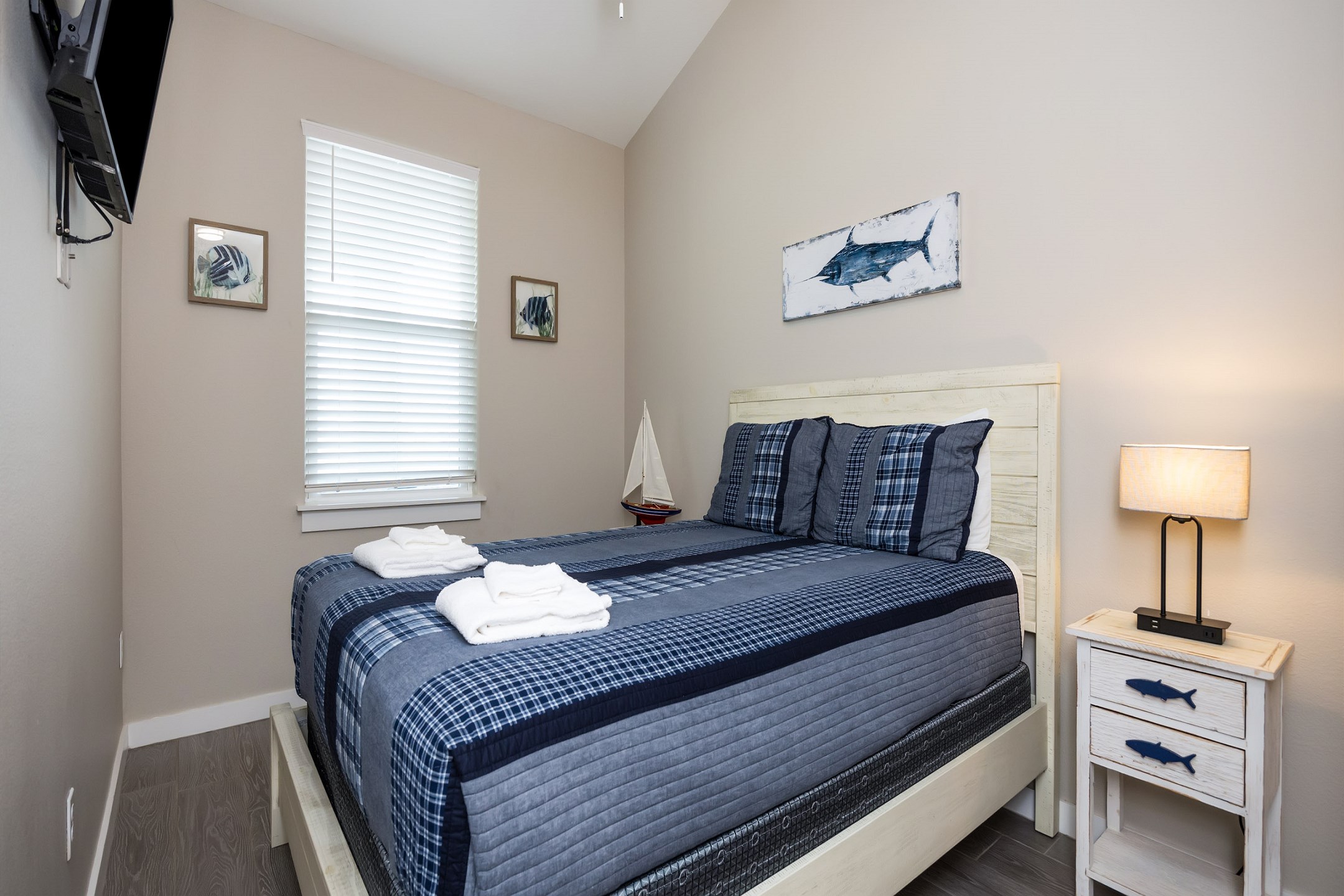 Second bedroom on the second floor with a full size bed and flat screen TV
