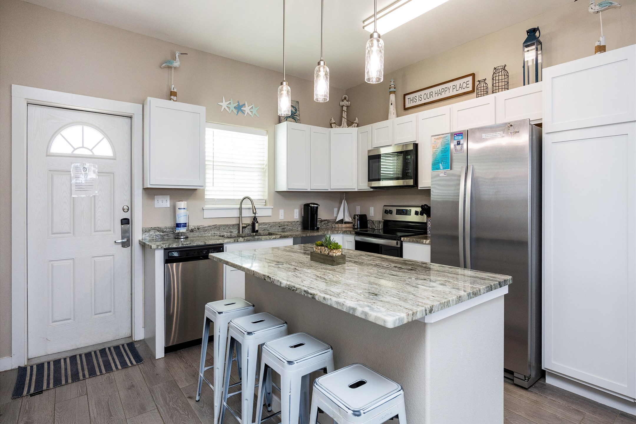 Elegant kitchen island and well-equipped kitchen