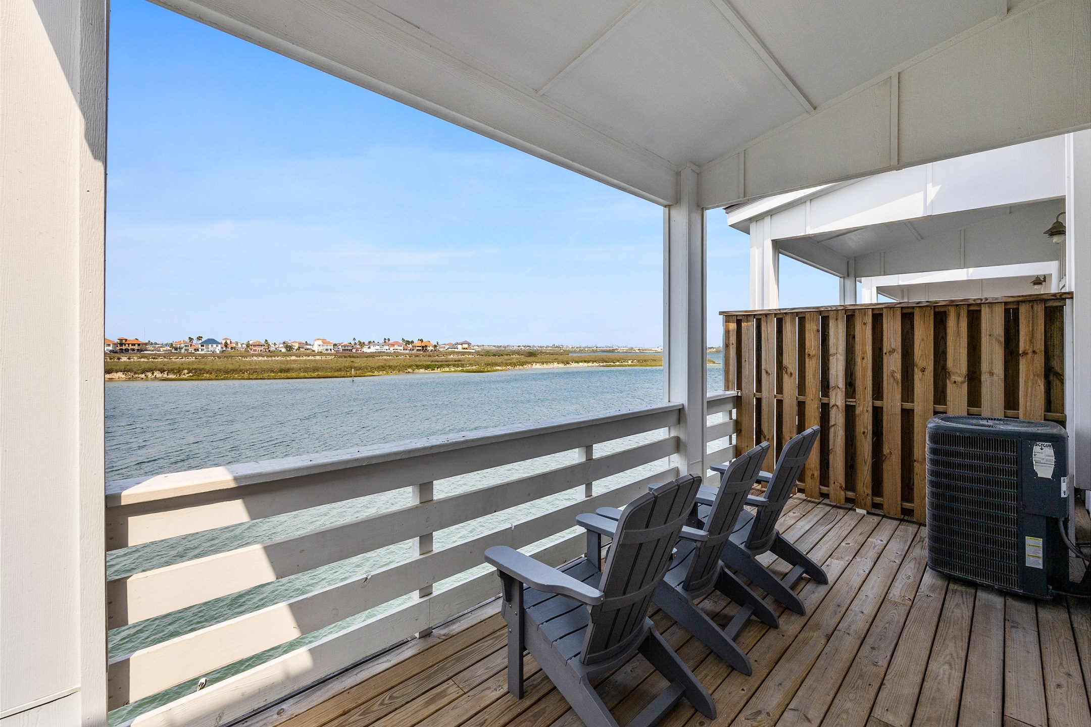 Relax on the master bedroom''s private balcony, equipped with inviting chairs to soak in the gentle Texas breeze