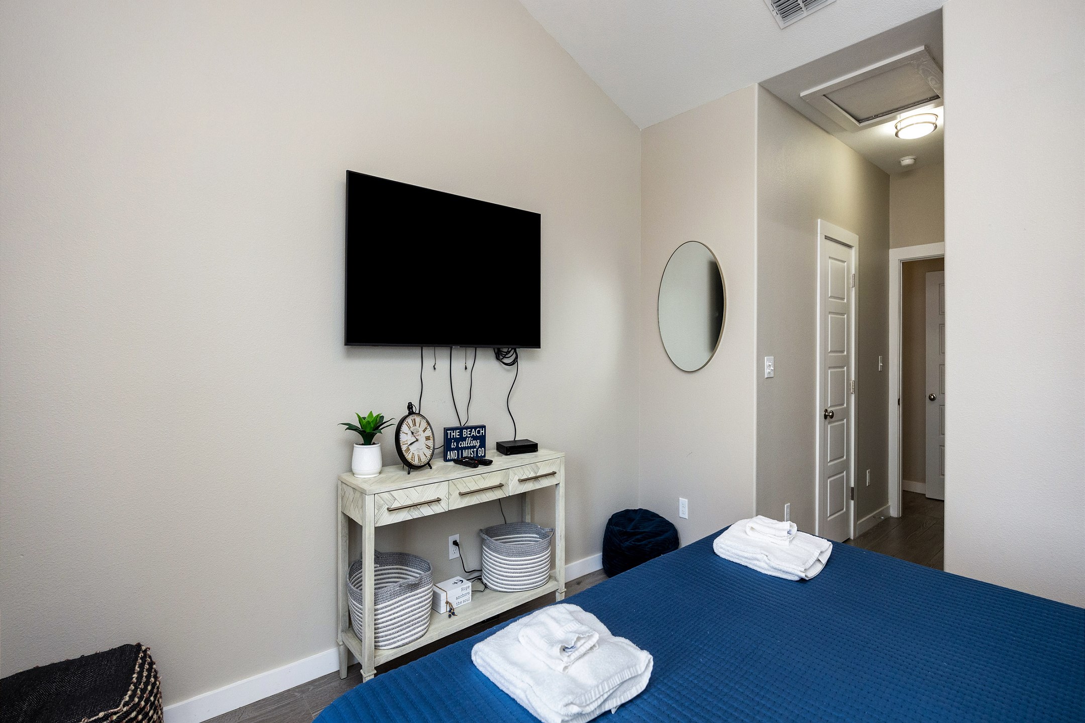 Master bedroom on the second floor with a king size bed, ensuite bathroom, private balcony with a water view and flat screen TV