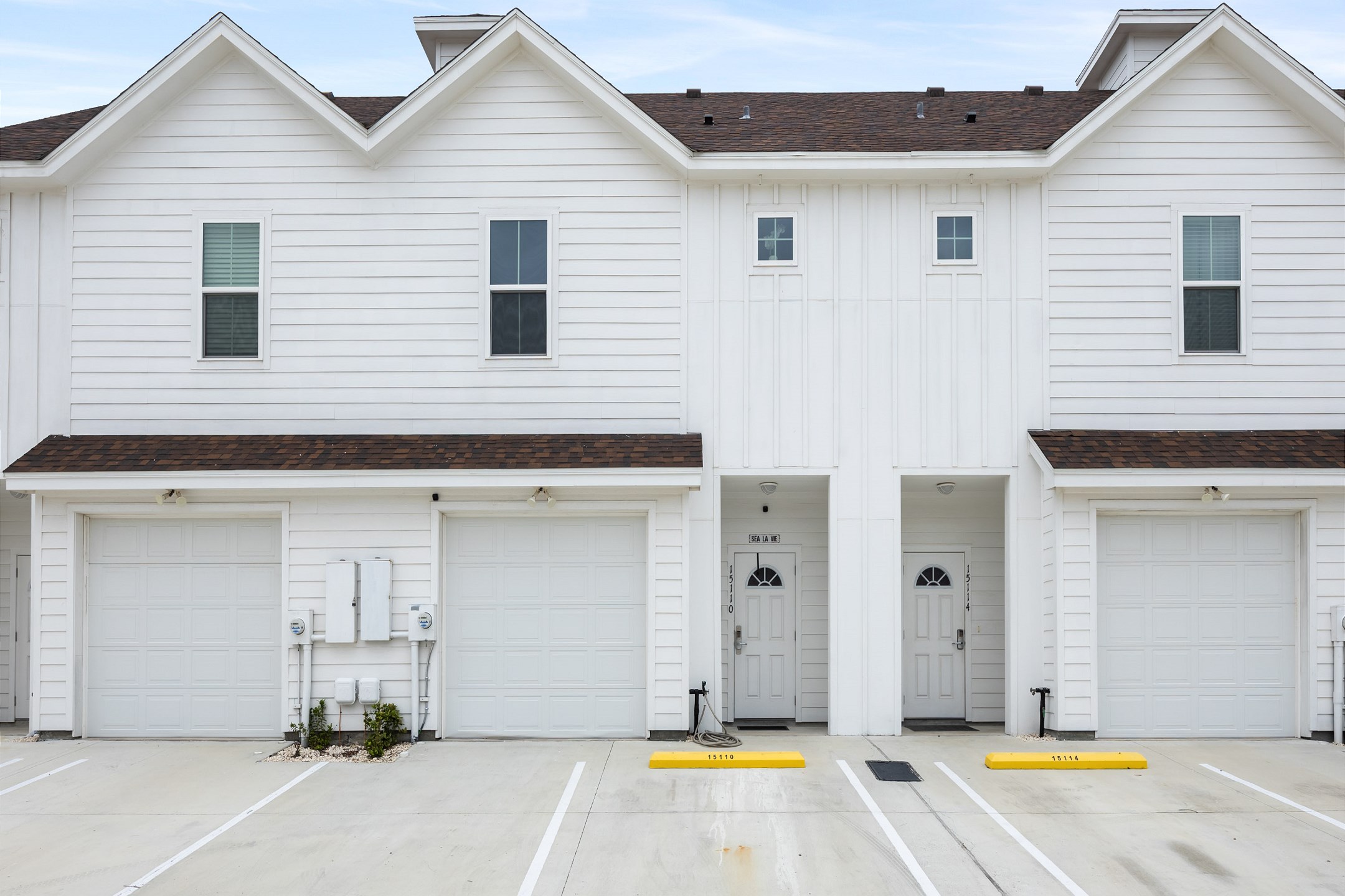 Front exterior with two parking spaces (no garage access)