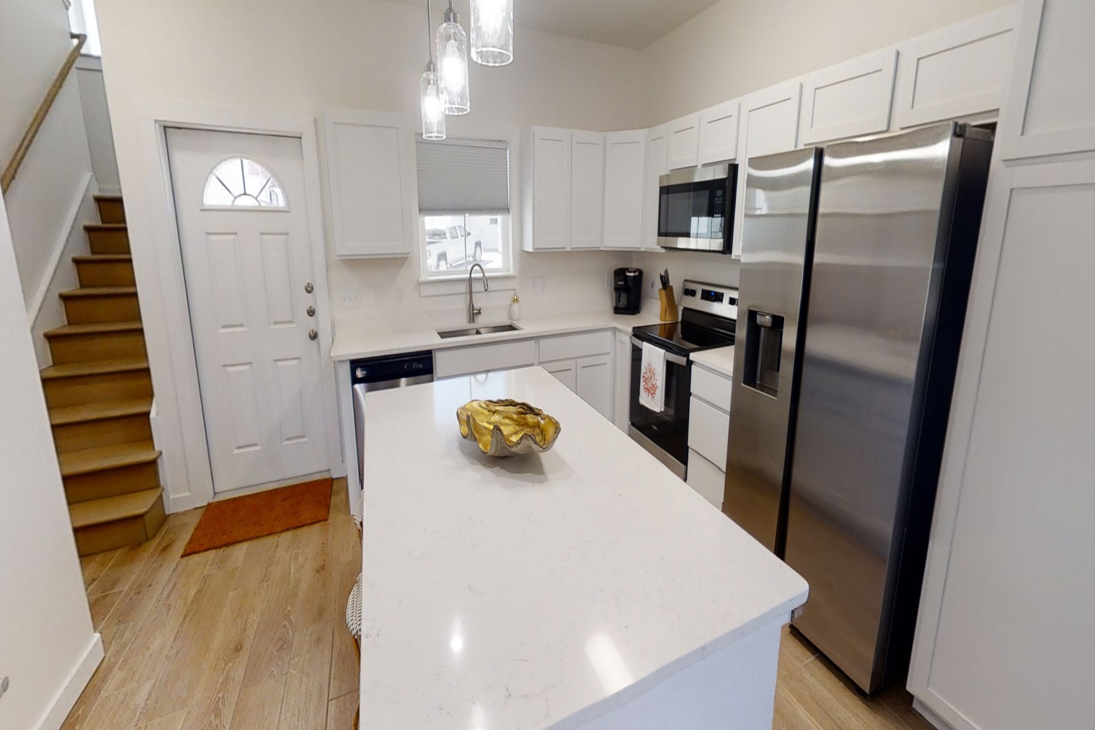 Well-appointed modern kitchen with beautiful granite countertops and generous space for cooking and entertaining