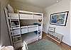 Third bedroom with two sets of twin over twin over twin bunk beds 