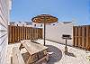 Back patio area with rocks and comfortable seating 