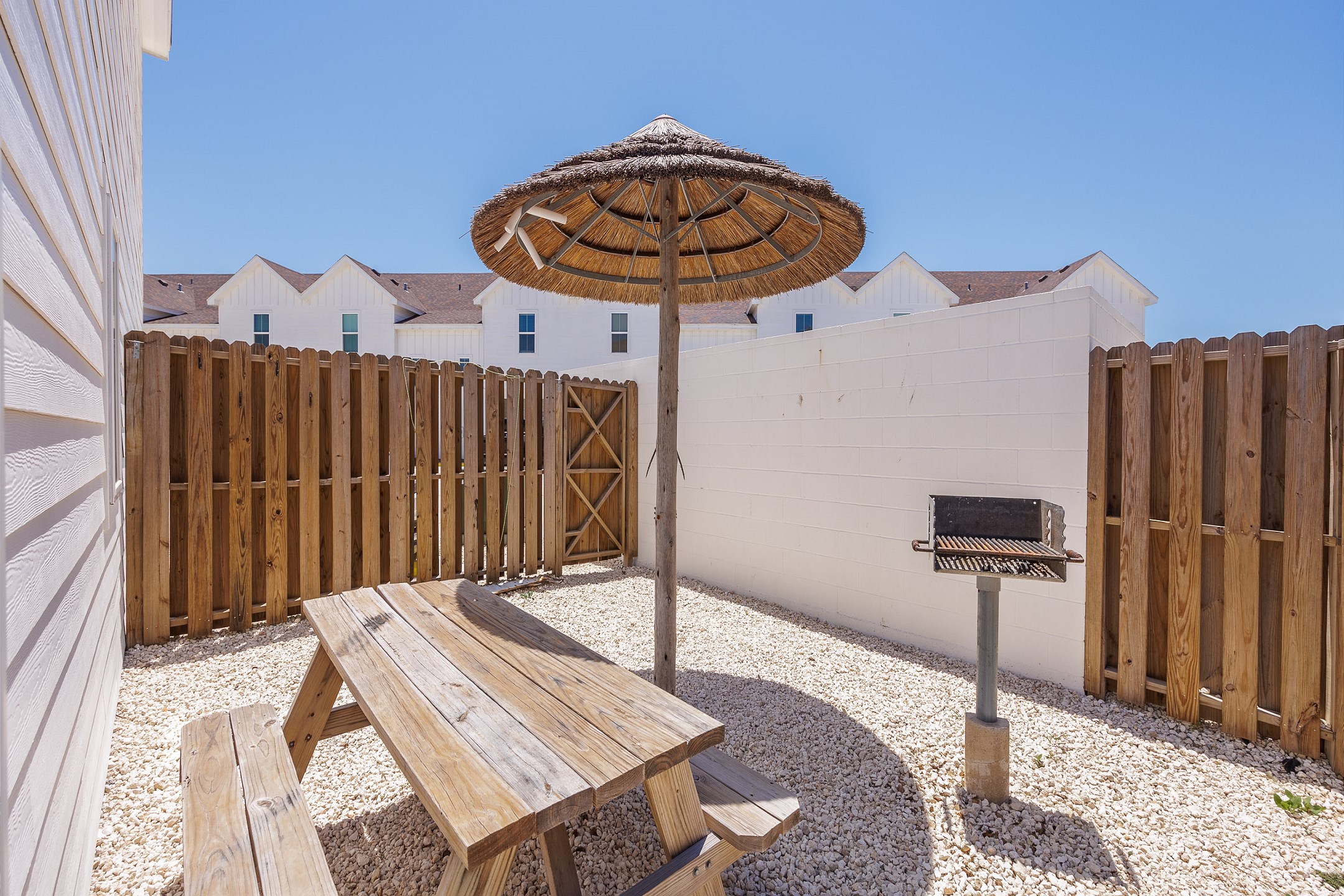 Just off the living room you''ll find an extended back patio area with a shade structure and one of the only properties with a private grill