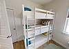 Third bedroom with two sets of twin over twin over twin bunk beds 