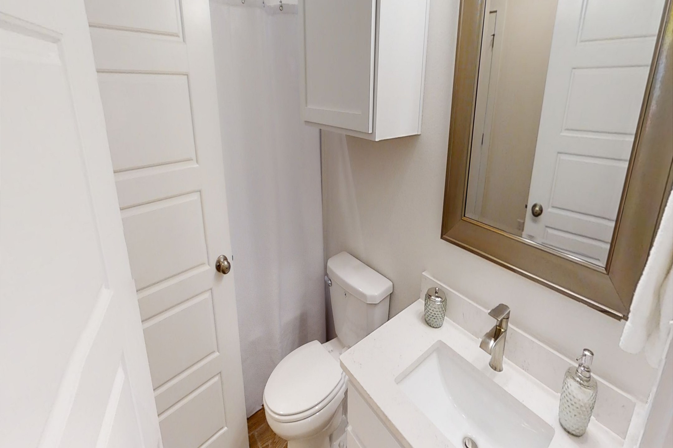 Guest bathroom on the second floor with sink and tub/shower combo