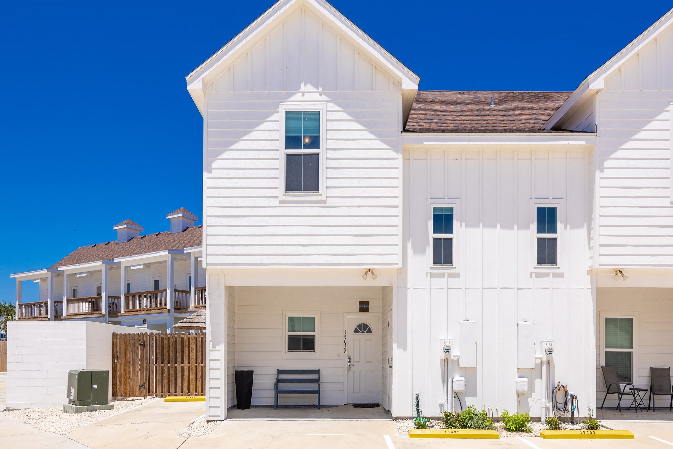 Front view of the property and reserved parking spaces right out front