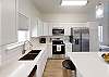 Open concept kitchen area with plenty of space to prepare family meals 