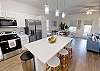 Fully equipped kitchen with barstools and coffee make