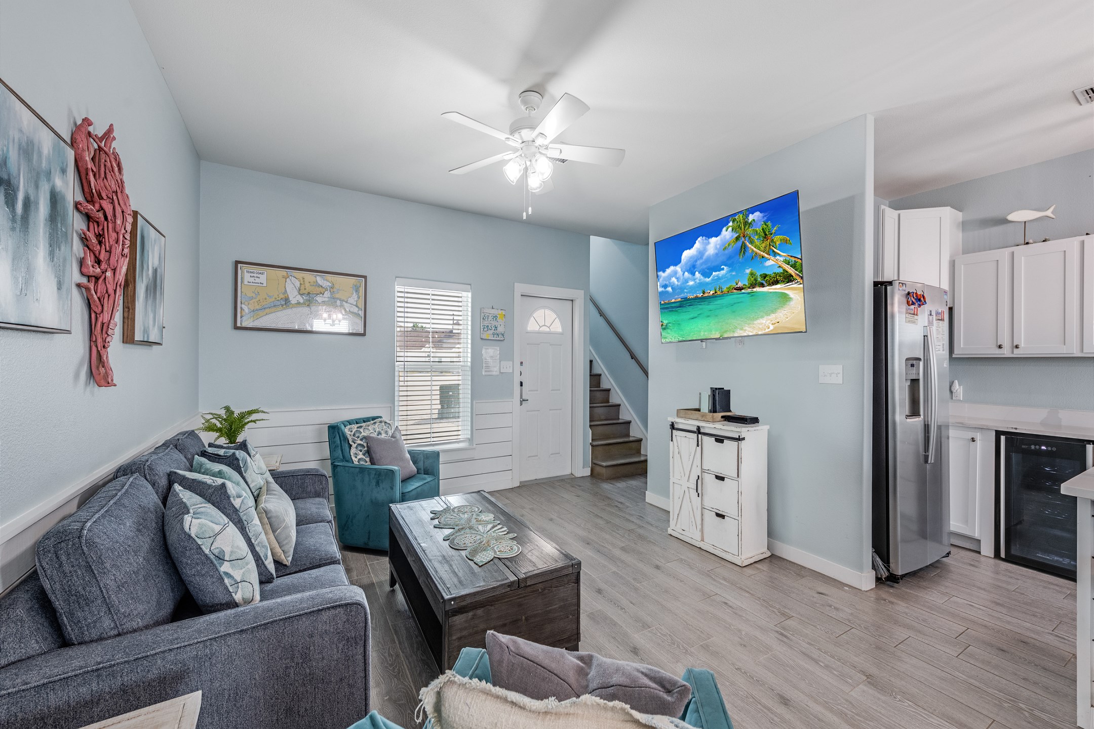 Luxurious open-concept living space featuring contemporary furnishings and bathed in natural light