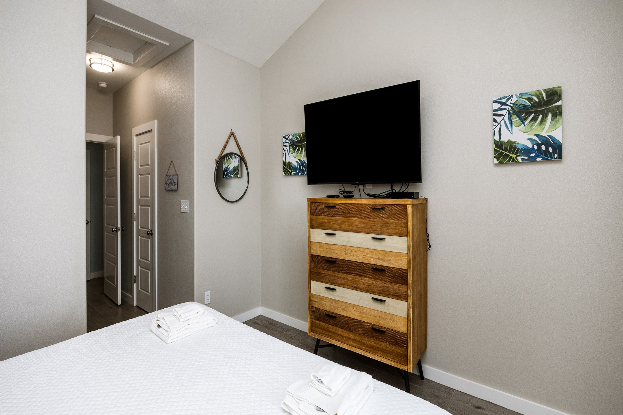 Master bedroom on the second floor with a king size bed, master bathroom, private balcony and flat screen TV