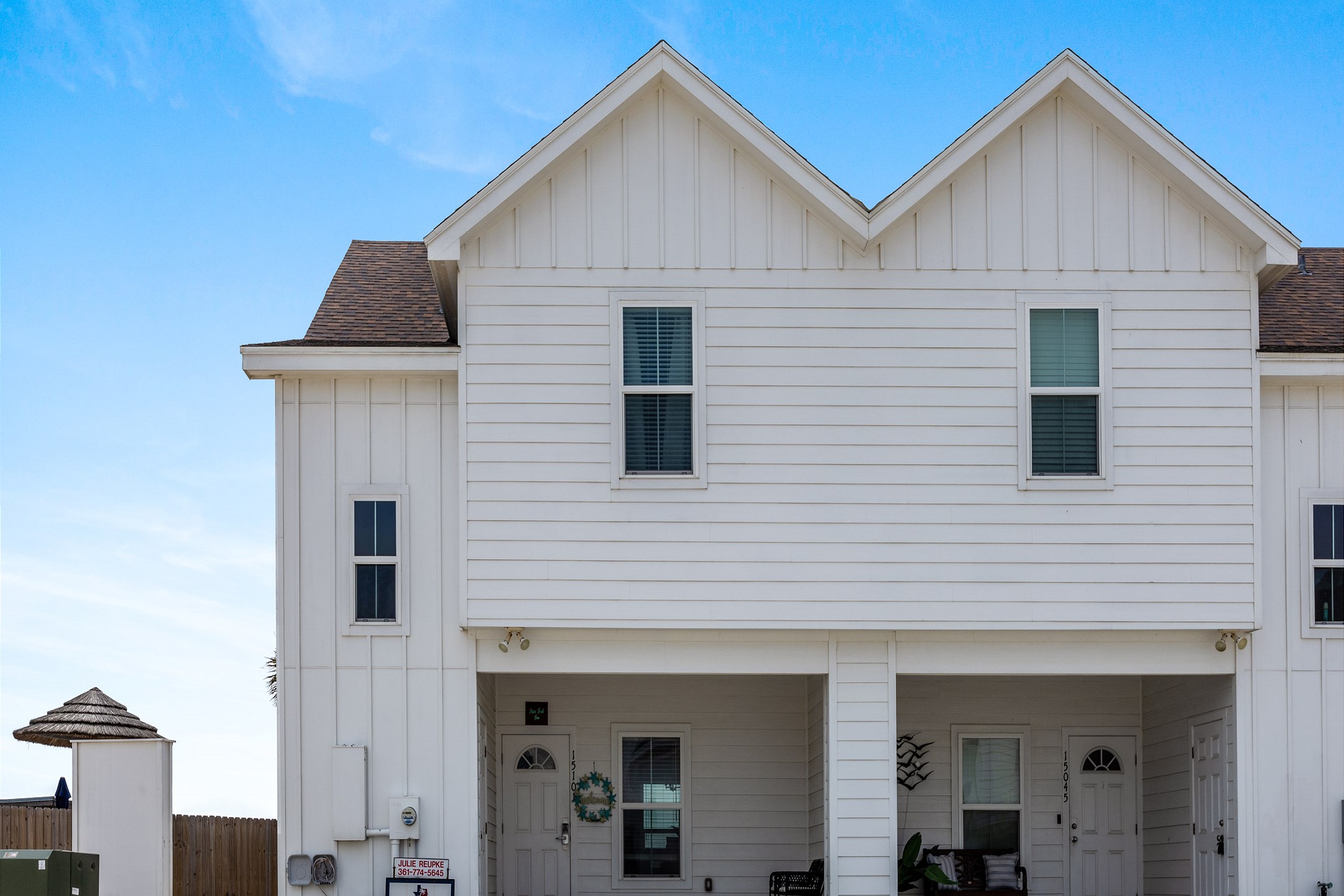 Front view of the property and two reserved parking spaces right out front
