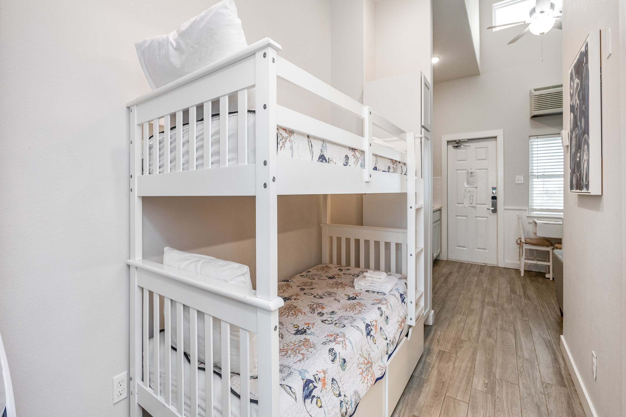 Two little ones will enjoy sleeping on the twin size bunk beds in the hallway nook