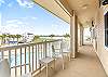 Front walkway with a great view of the pool, Kokomo Yacht Club and canals in the background