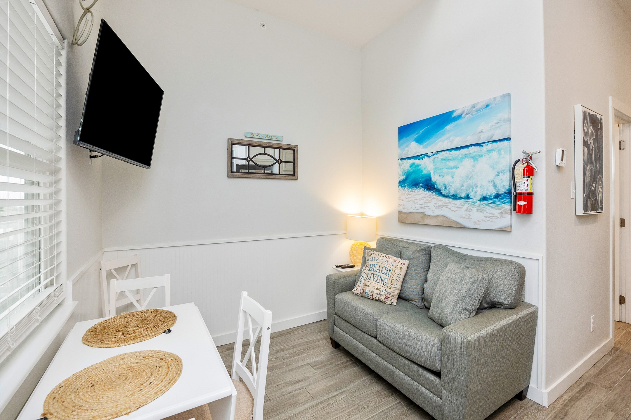 Comfy living area with twin sleeper sofa and flat screen TV