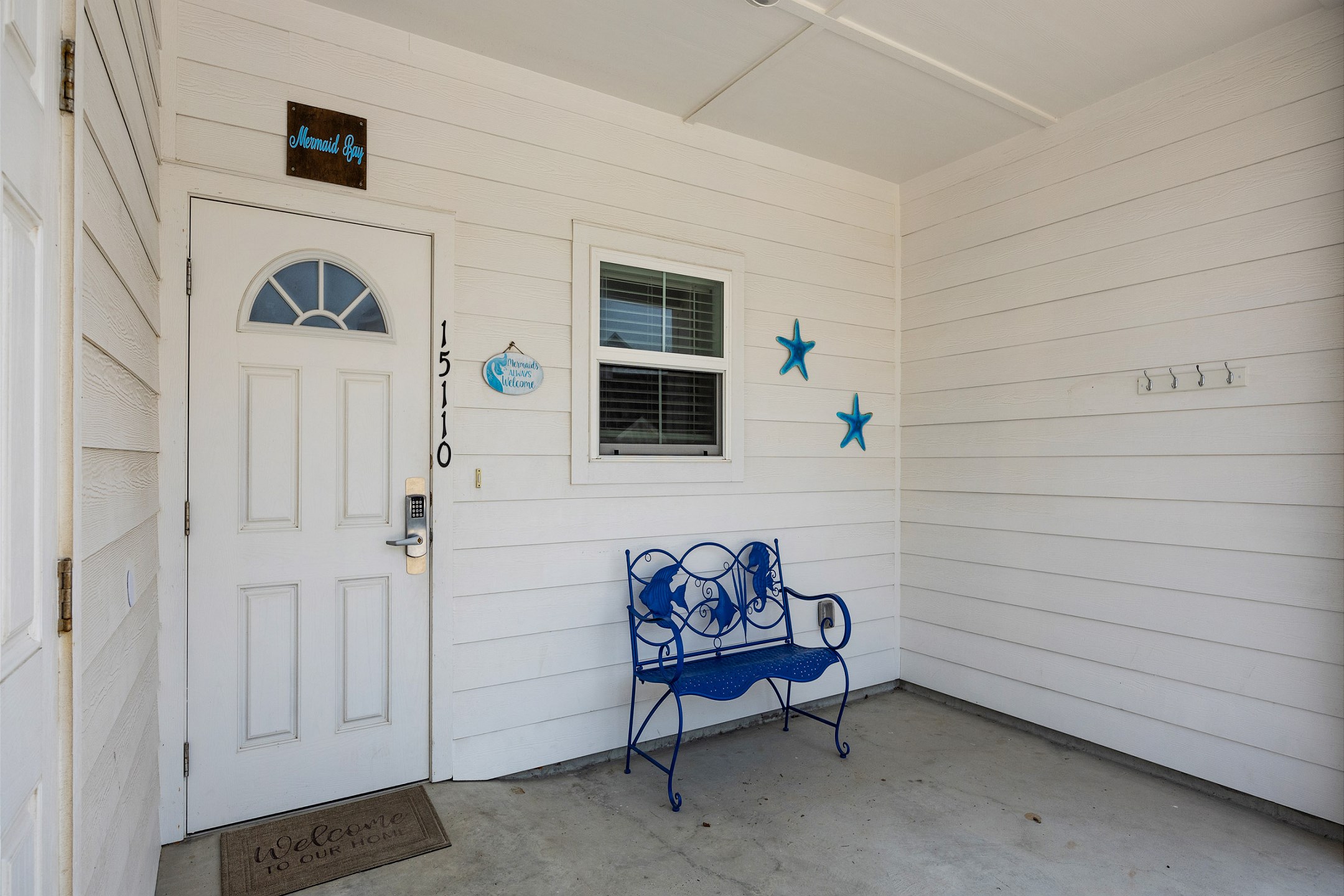 Front entrance to property with a shaded covering and seating 