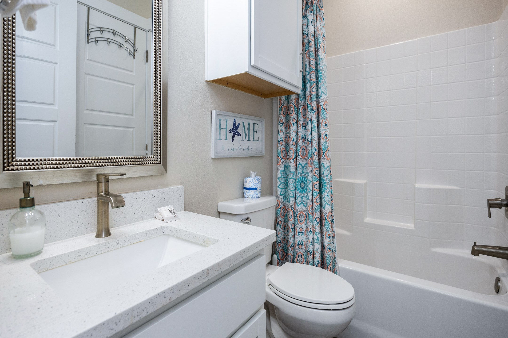 The second-floor guest bathroom includes a sink and a tub/shower combo—perfect for a relaxing soak or a quick rinse after a day of adventure.