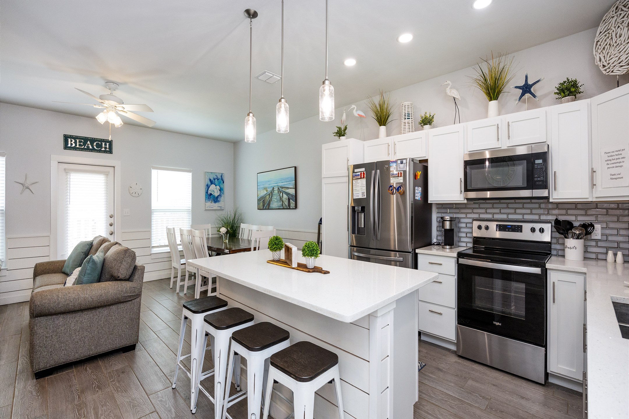 Inviting family hub with seamlessly integrated kitchen, dining, and living areas, perfect for creating lasting memories